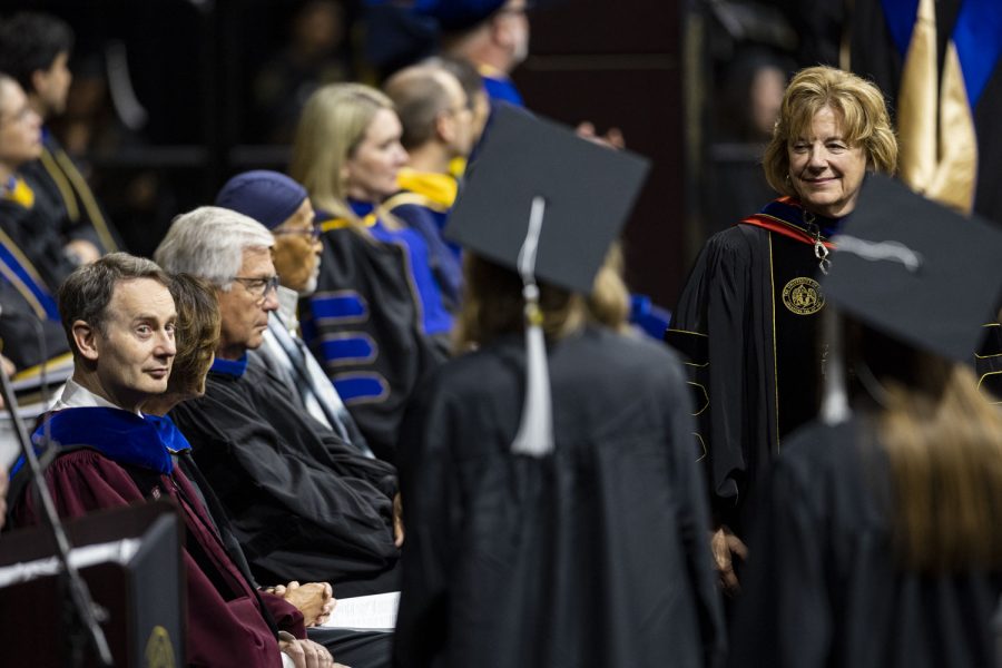 University of Iowa President Barbara Wilson shakes a graduate’s hand during the University of Iowas spring 2023 Commencement Ceremony for the College of Liberal Arts and Sciences at Carver-Hawkeye Arena on Saturday, May 13, 2023. The ceremony marks one of two Liberal Arts and Sciences ceremonies.