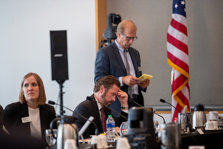 State Board of Regents Greta Rouse, JC Risewick, and Robert Cramer prepare during a three minute intermission at a Board of Regents meeting in Iowa City on Wednesday, June 14, 2023.