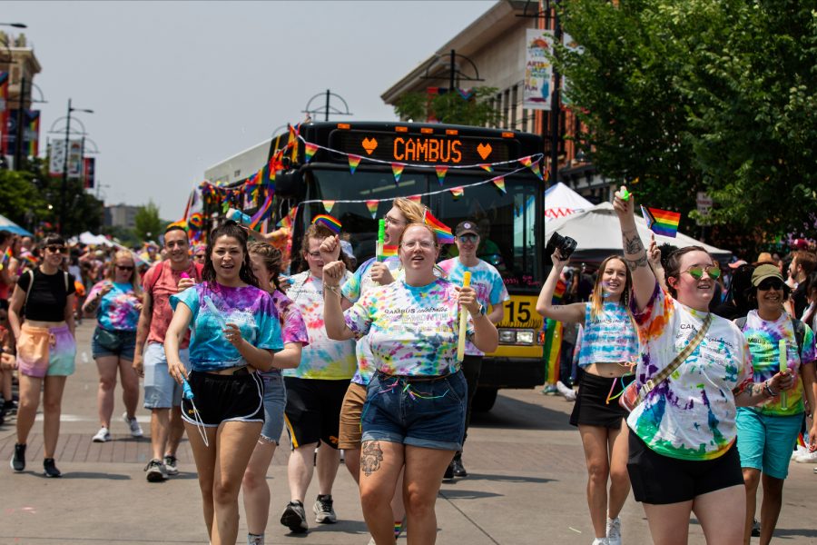 Iowa City residents walk the parade route during the 2023 Pride Parade & Festival in downtown Iowa City on Saturday, June 17, 2023.