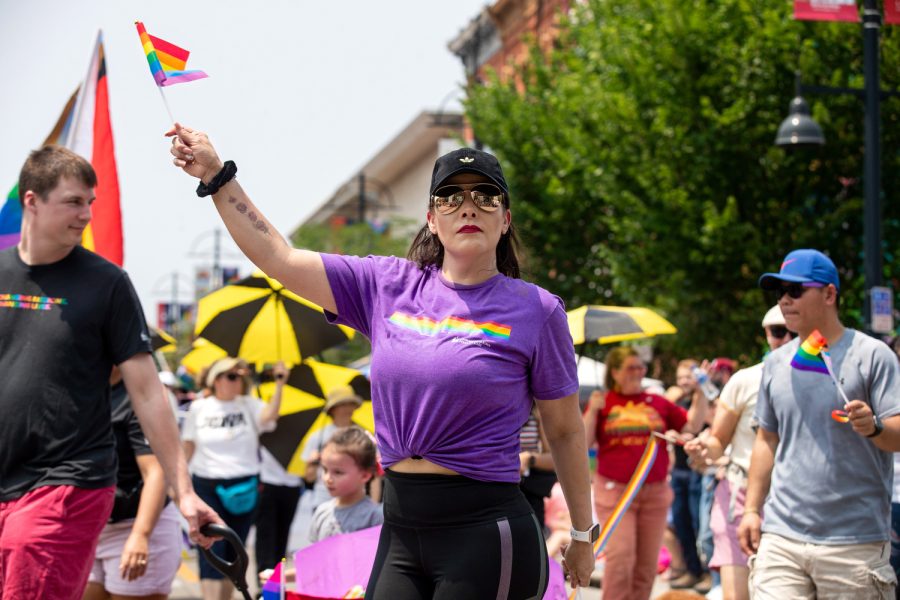 A University of Iowa healthcare member walks the parade route during the 2023 Pride Parade & Festival in downtown Iowa City on Saturday, June 17, 2023.