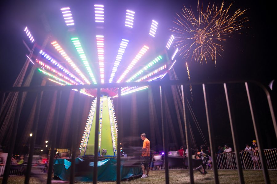 Fireworks explode over a carnival ride during the annual 4thFest in Coralville on Tuesday, July 4, 2023. 