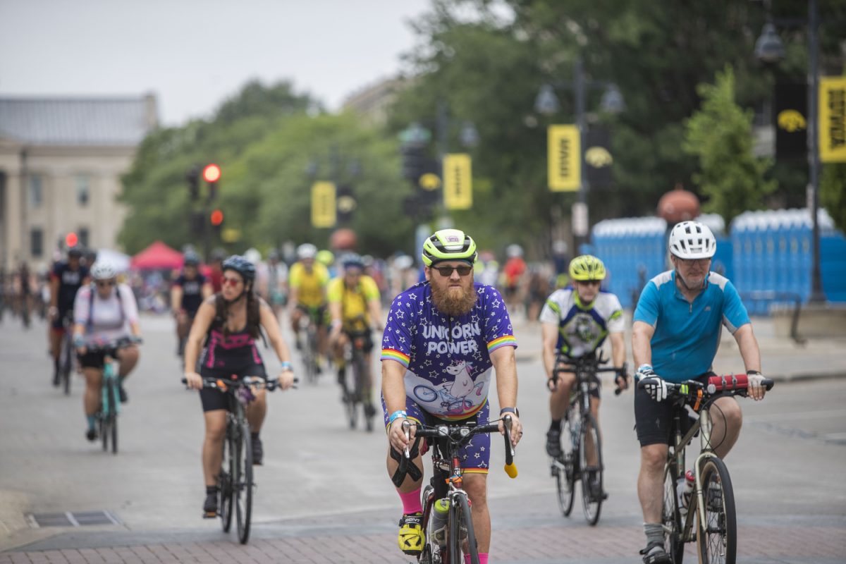 A group leaves Iowa City decked out in different biker jerseys. The bikers make their way to Davenport from Iowa City on July 29, 2023.