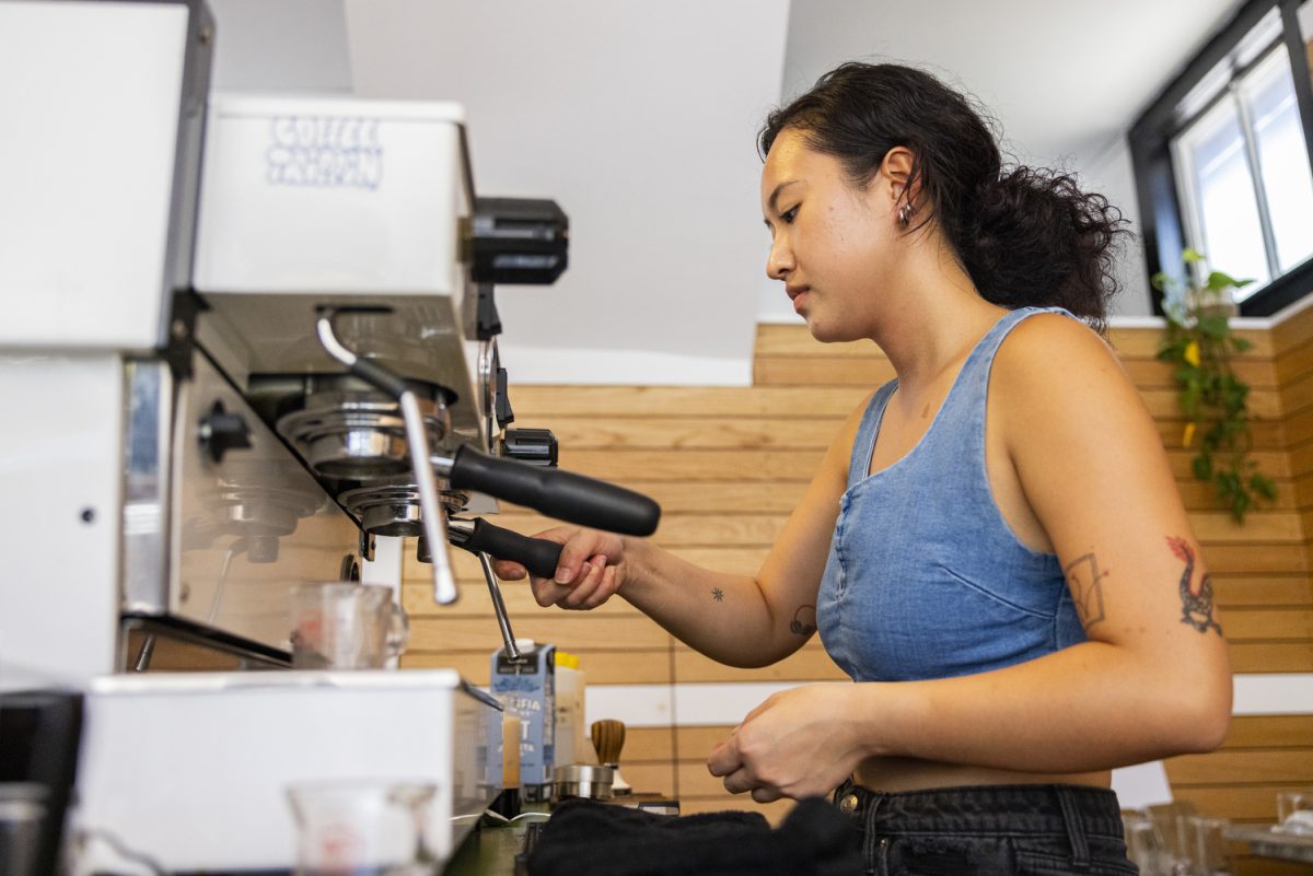 Barista Kara Thai makes coffee at Daydrink’s new location on Bowery Street in Iowa City on Thursday, Aug. 24, 2023. Daydrink on Bowery Street, which also has a location on the Pedestrian Mall, opened its doors on Thursday to eager coffee and tea drinkers.