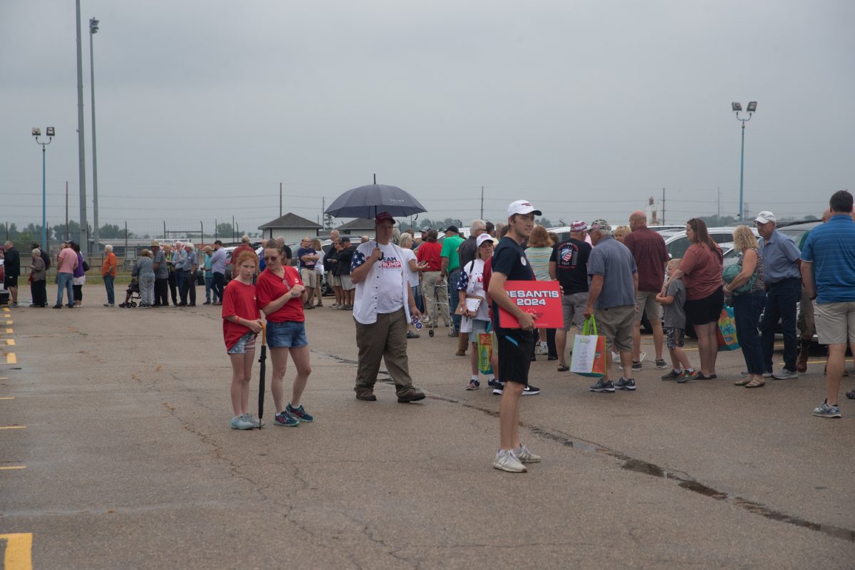 Attendees lineup outside before Ashley Hinson’s BBQ Bash at Hawkeye Downs in Cedar Rapids, Iowa on Sunday, August 6, 2023.