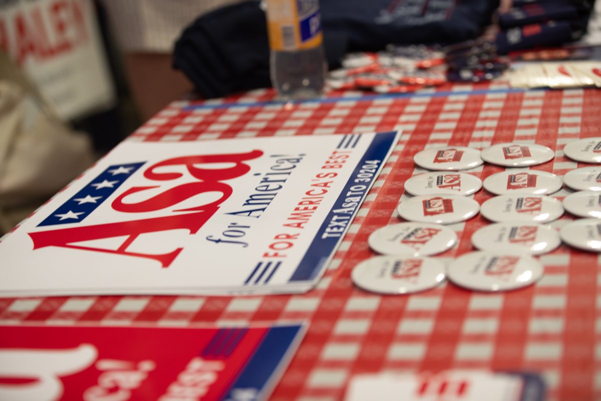 A table with political merchandise for 2024 presidential candidate Asa Hutchinson is displayed during Ashley Hinson’s BBQ Bash at Hawkeye Downs in Cedar Rapids, Iowa Sunday, August 6, 2023.