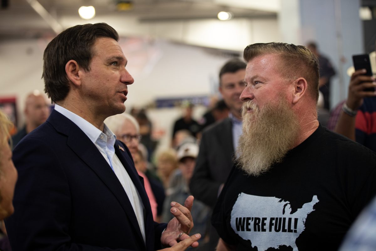 Florida Governor and 2024 presidential candiate Ron DeSantis speaks with an attendee during Ashley Hinson’s BBQ Bash at Hawkeye Downs in Cedar Rapids, Iowa on Sunday, August 6, 2023.