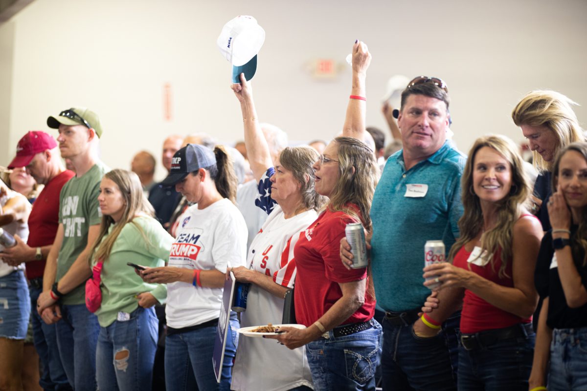 Attendees cheer during Ashley Hinson’s BBQ Bash at Hawkeye Downs in Cedar Rapids, Iowa on Sunday, August 6, 2023.