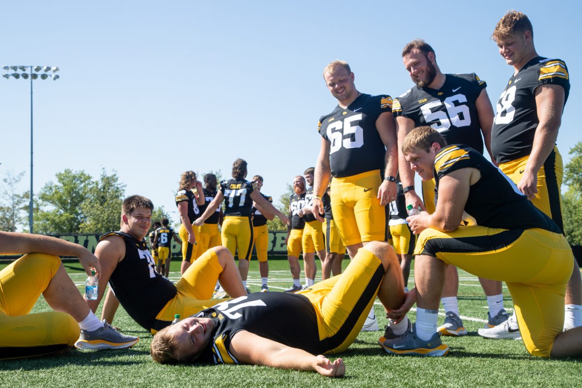 Iowa offensive players interact during Iowa football media day in Iowa City on Friday, August 11, 2023.