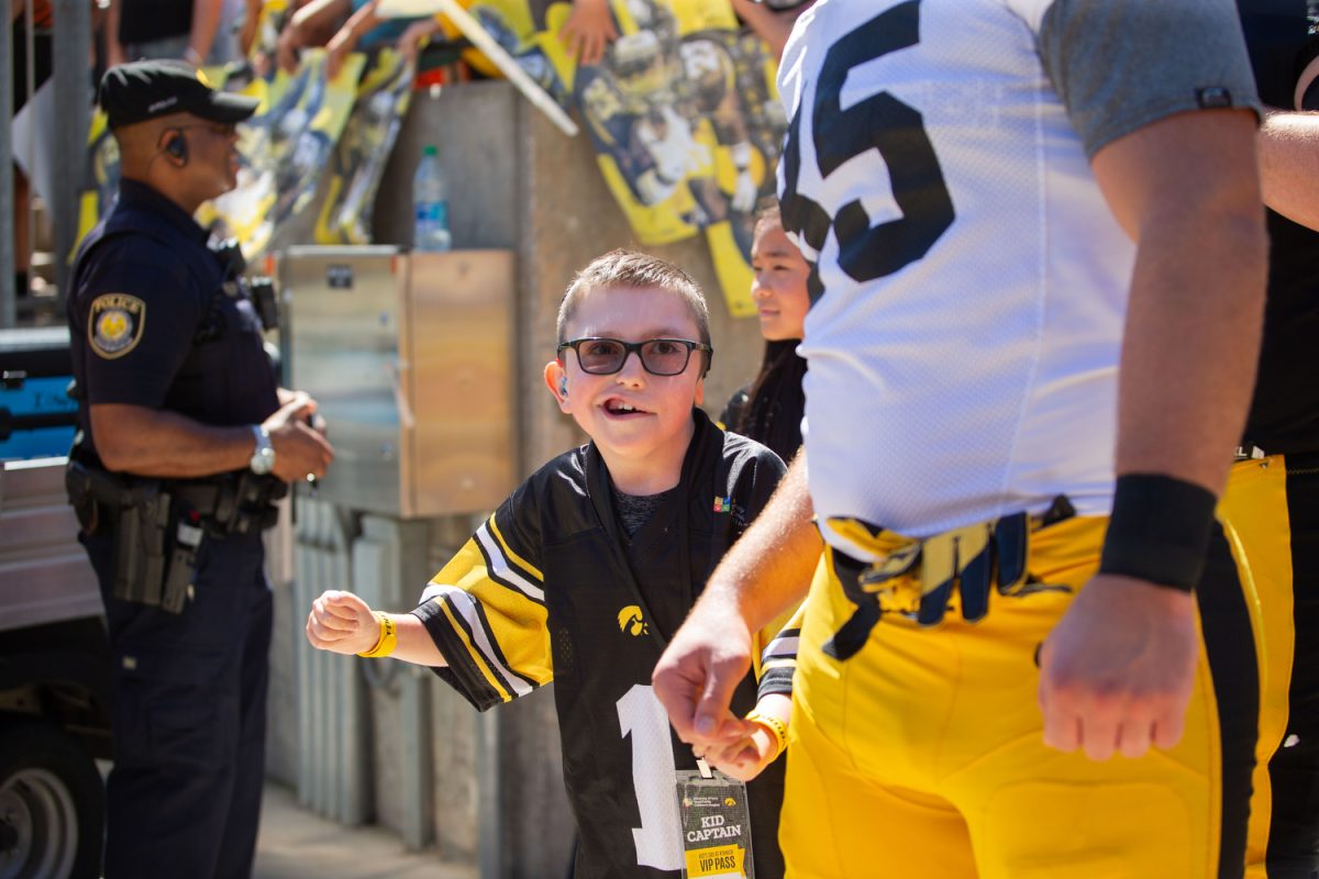 Kid+captain+Bentley+Erickson+reacts+as+he+exits+the+Kinnick+tunnel+during+Kids%E2%80%99+Day+at+Kinnick+in+Iowa+City+on+Saturday%2C+Aug.+12%2C+2023.