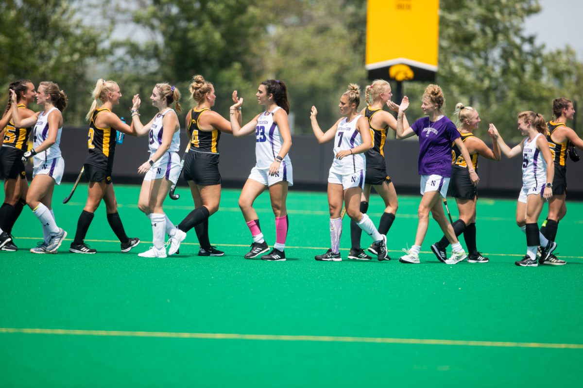 Iowa and Northwestern congratulate each other after a field hockey exhibition match between Iowa and Northwestern at Grant Field in Iowa City on Saturday, Aug. 19, 2023. The Hawkeyes defeated the Wildcats, 3-1, at their first home game of the season.