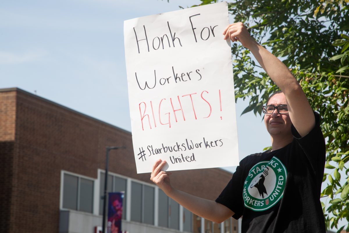Luis Aispuro holds a sign during a workers strike in Iowa City on Monday, Aug. 21, 2023. 