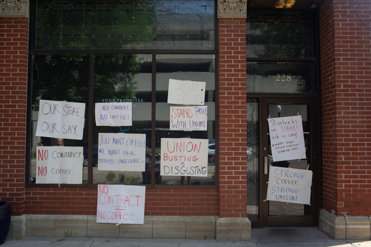 Signs advocating for worker’s rights at Starbucks during a strike in Iowa City on Aug. 21, 2023. 