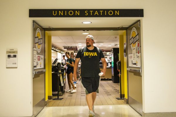 UI student Billy Stoynoff walks out of Union Station in the Iowa Memorial Union at the University of Iowa in Iowa City on Tuesday, Aug. 22, 2023. Stoynoff is a 33-year-old transfer student entering his third year in college. To document his experience adapting to Iowa City as a nontraditional student, he began making TikTok videos and has amassed over 6,000 followers in just about two weeks. During his TikTok journey so far, Stoynoff continues to spread positivity, making people happy with his videos. 