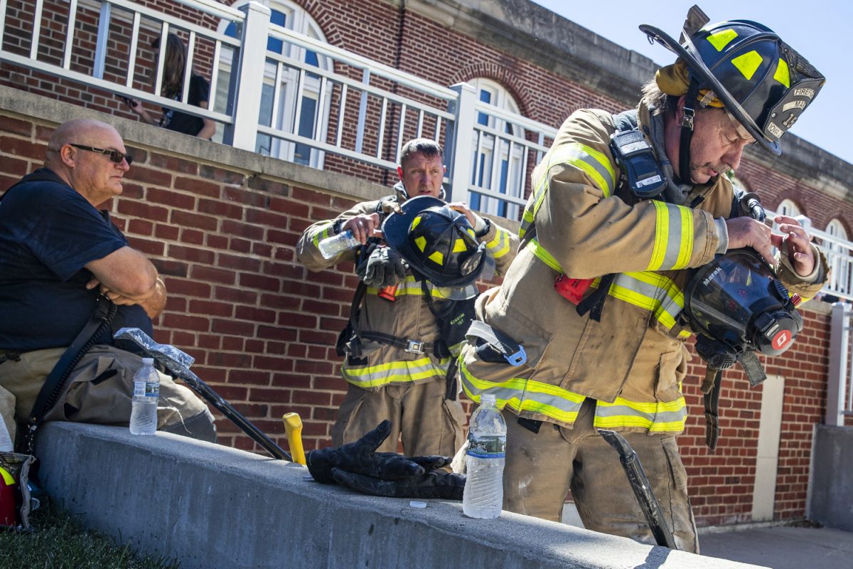 Iowa City firefighter Brian Marak takes off his gear after responding to an active fire at the Advanced Technology Lab on the University of Iowa campus in Iowa City on Thursday, Aug. 31, 2023. The first Hawk Alert went out at 1:29 p.m., urging people to avoid the area. At 1:58 p.m., a second Hawk Alert said people could resume normal activity, as the situation “has stabilized.” 