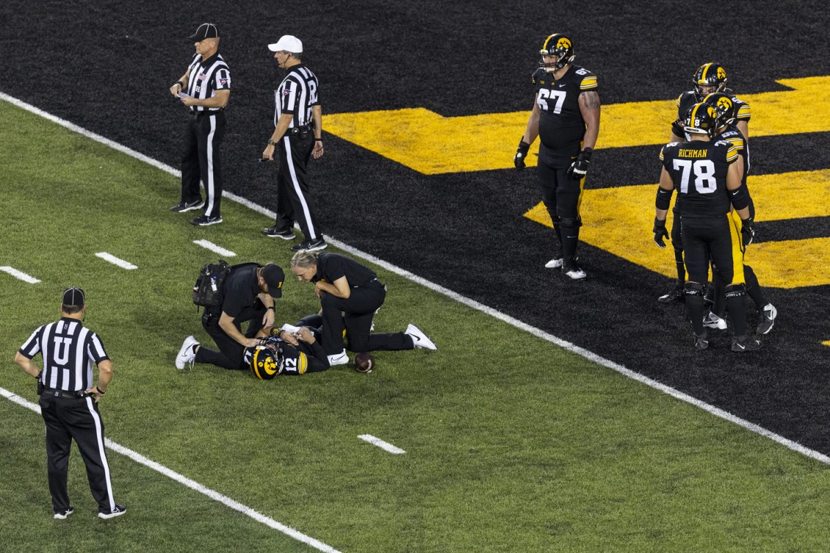 Iowa quarterback Cade McNamara goes down during a football game between Iowa and Michigan State at Kinnick Stadium on Saturday, Sept. 30, 2023. (Ayrton Breckenridge/The Daily Iowan)