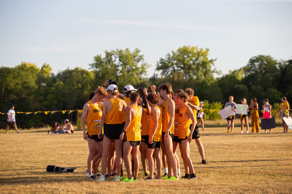 The+Iowa+mens+cross+country+team+huddles+before+the+Hawkeye+invite+at+Ashton+Cross-Country+Course+in+Iowa+City%2C+on+Friday%2C+Sep.+1%2C+2023.+The+Iowa+mens+team+won+the+invite+with+the+women+coming+in+second+second.