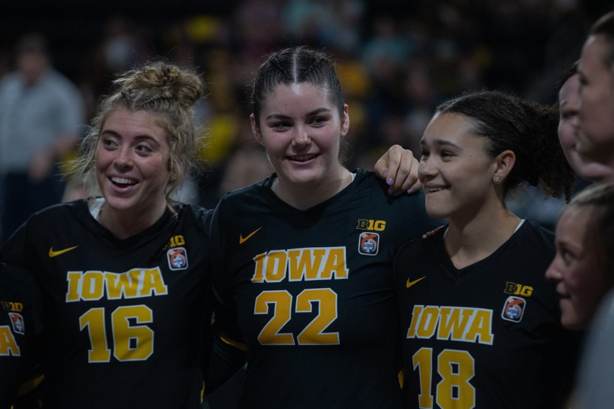 Rosa Vesty smiles with her teammates during a timeout at a volleyball game between Iowa and Middle Tennessee State on Sep. 1, 2023. The Hawkeyes beat the Blue Raiders, 3-0.