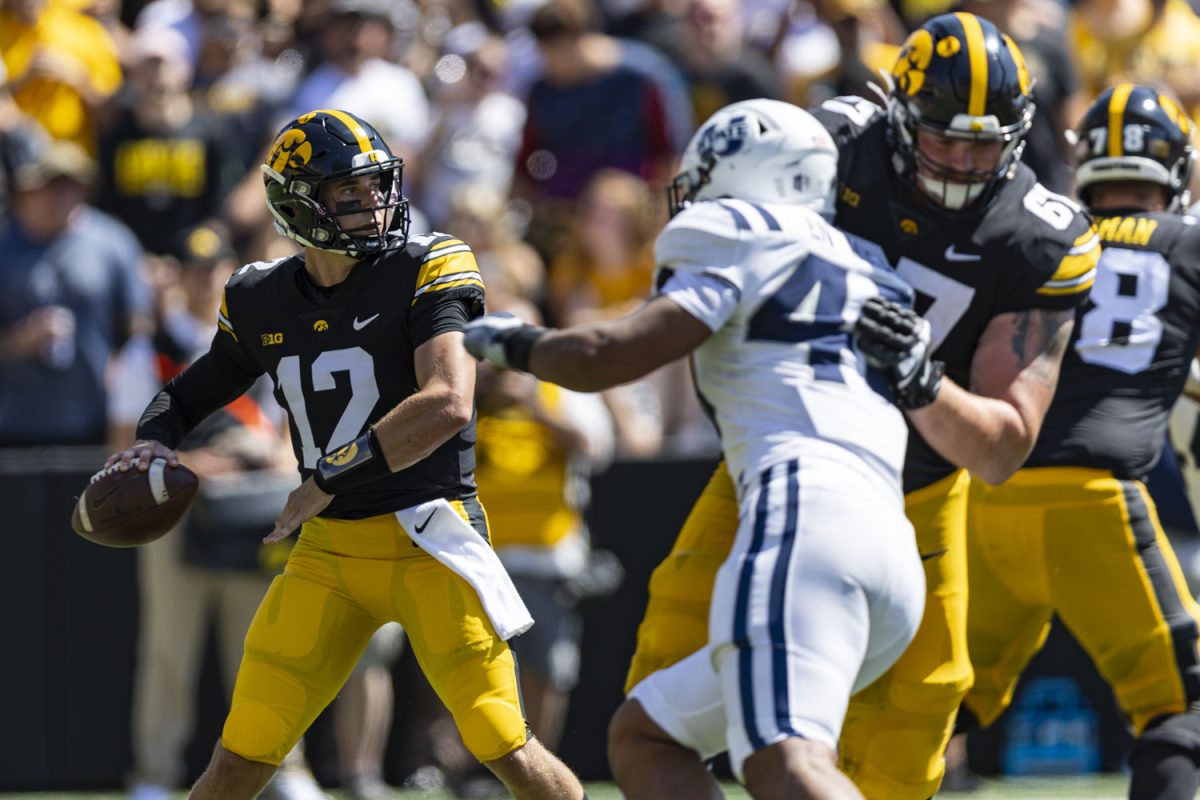Iowa+quarterback+Cade+McNamara+prepares+to+throw+the+ball+during+a+football+game+between+No.+25+Iowa+and+Utah+State+at+Kinnick+Stadium+on+Saturday%2C+Sept.+2%2C+2023.+The+Hawkeyes+defeated+the+Aggies%2C+24-14.