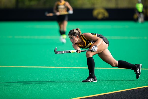 Iowa defense Lauren DeRose (14) watches after hitting the ball during the game against the Vermont Catamounts at Grant Field in Iowa City on Sept. 15, 2023. The Hawkeyes defeated the Catamounts 5-0.