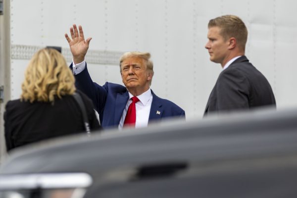 Republican presidential candidate and former President Donald Trump waves to supporters before a Cy-Hawk football game between Iowa and Iowa State at Jack Trice Stadium in Ames on Saturday, Sept. 9, 2023. The Hawkeyes defeated the Cyclones, 20-13. Trump attended the game after speaking with supporters outside the stadium.