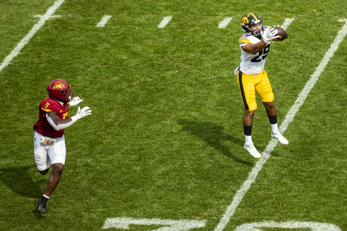 Iowa defensive back Sebastian Castro catches an interception for pick-six during a Cy-Hawk football game between Iowa and Iowa State at Jack Trice Stadium in Ames on Saturday, Sept. 9, 2023. The Hawkeyes defeated the Cyclones, 20-13. Castro intercepted the ball once for 30 yards and a touchdown.