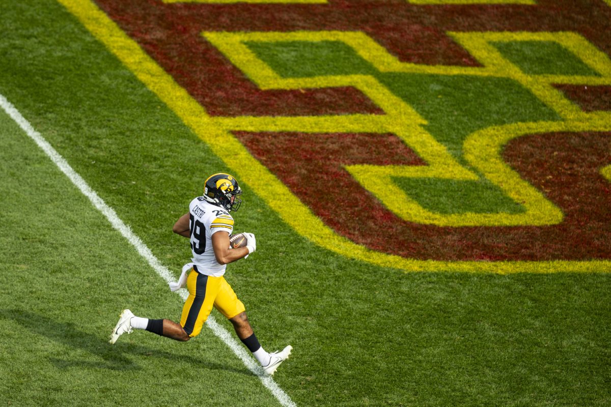 Iowa defensive back Sebastian Castro runs to the end zone after catching an interception for a pick-six during a Cy-Hawk football game between Iowa and Iowa State at Jack Trice Stadium in Ames on Saturday, Sept. 9, 2023. The Hawkeyes defeated the Cyclones, 20-13. Castro intercepted the ball once for 30 yards and a touchdown.