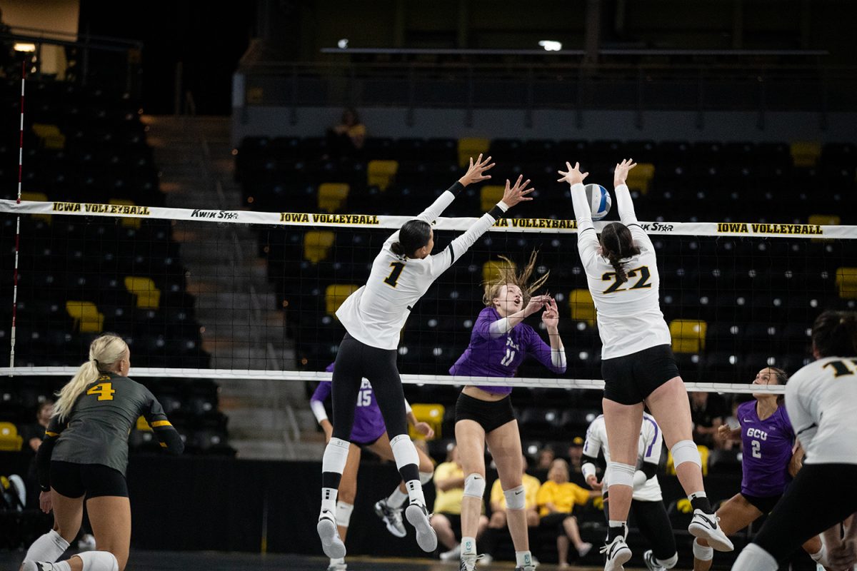 Outside hitter Nataly Moravec and middle hitter Rosa Vesty seen blocking a spike during a volleyball match between Iowa and Grand Canyon University at Xtream Arena in Coralville on September 10, 2023. The Antleopes defeated the Hawkeyes 3-0.
