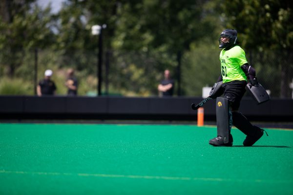 Iowa goalkeeper Mia Magnotta directs her teammates during a field hockey exhibition match between Iowa and Northwestern at Grant Field in Iowa City on Saturday, Aug. 19, 2023. The Hawkeyes defeated the Wildcats, 3-1.