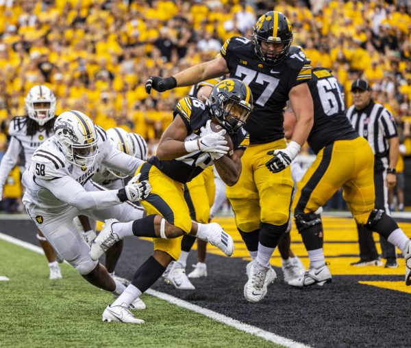 Iowa running back Kamari Moulton carries the ball into the end zone for a touchdown during a football game between Iowa and Western Michigan at Kinnick Stadium in Iowa City on Saturday, Sept. 16, 2023. The Hawkeyes defeated the Broncos, 41-10. Moulton carried the ball for 50 yards and two touchdowns.