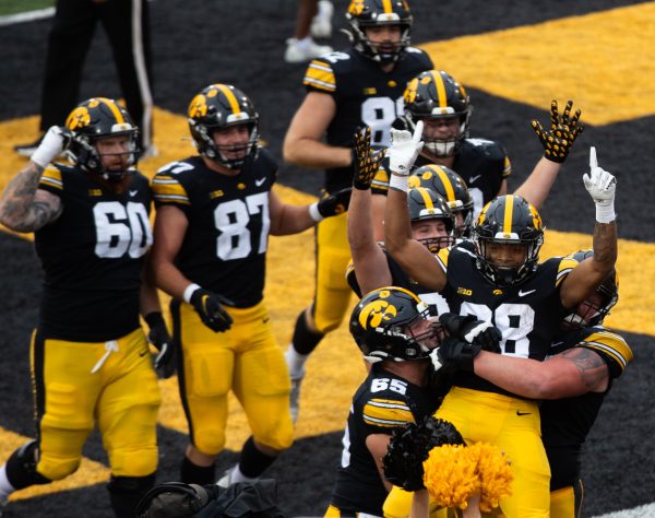 Iowa players celebrate a touchdown by running back Kamari Moulton during a football game between Iowa and Western Michigan at Kinnick Stadium in Iowa City on Saturday, Sept. 16, 2023. Moulton carried the ball for 50 yards and two touchdowns. The Hawkeyes defeated the Broncos, 41-10.