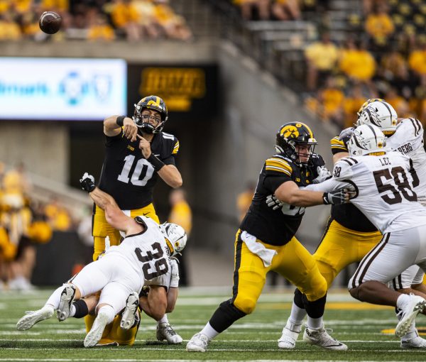Iowa quarterback Deacon Hill throws a pass during a football game between Iowa and Western Michigan at Kinnick Stadium in Iowa City on Saturday, Sept. 16, 2023. The Hawkeyes defeated the Broncos, 41-10. Hill made his game debut in the fourth quarter, completing two passes on three attempts.