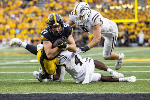 Iowa tight end Addison Ostrenga dives with the ball during a football game between Iowa and Western Michigan at Kinnick Stadium in Iowa City on Saturday, Sept. 16, 2023. The Hawkeyes defeated the Broncos, 41-10. Ostrenga received the ball two times for 19 yards.