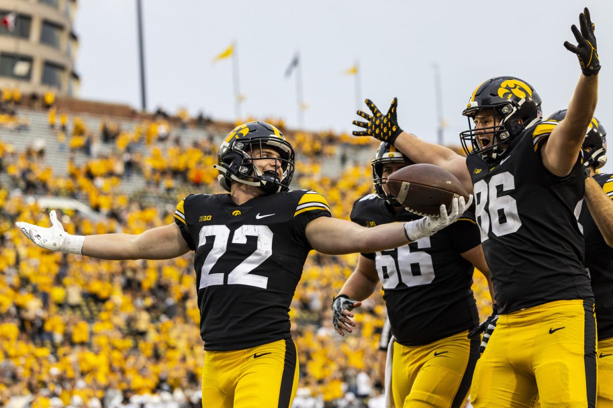 Iowa running back Max White and his teammates celebrate White’s touchdown during a football game between Iowa and Western Michigan at Kinnick Stadium in Iowa City on Saturday, Sept. 16, 2023. The Hawkeyes defeated the Broncos, 41-10. White rushed the ball three yards and a touchdown.