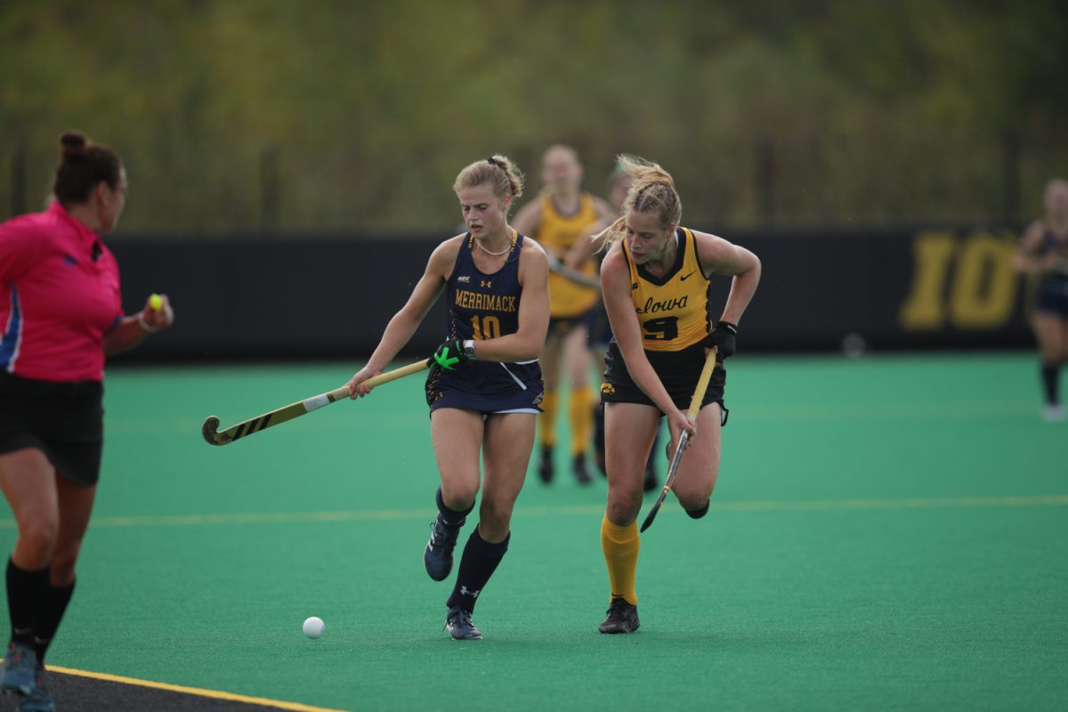 Merrimack College back/midfielder, Julie Wester (10) fights for the ball against Iowa Hawkeye midfielder/forward, Sofie Stribos (9) on Sept. 17, 2023 at Grant Field in Iowa City.