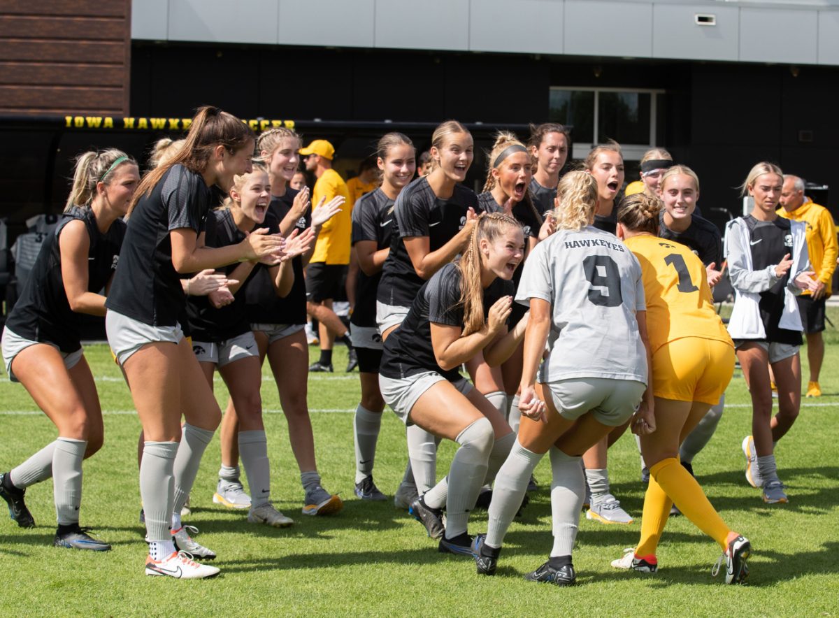 Iowa soccer players cheer on the starters before a soccer game between Iowa and Illinois at the University of Iowa Soccer Complex in Iowa City on Sunday, Sept. 17, 2023. Sunday’s game marked Iowa’s Big 10 home opener. The Hawkeyes and the Fighting Illini tied 1-1.