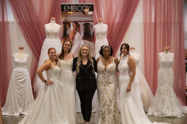 Rachel DeRycke, Sam Boddicke, Eyrnn DeRycke, Tea B., Kathrine Lewis-Silba model Embody Bridals selection of wedding gowns at the Hyatt Regency Conference Center on Sept. 17, 2023.
