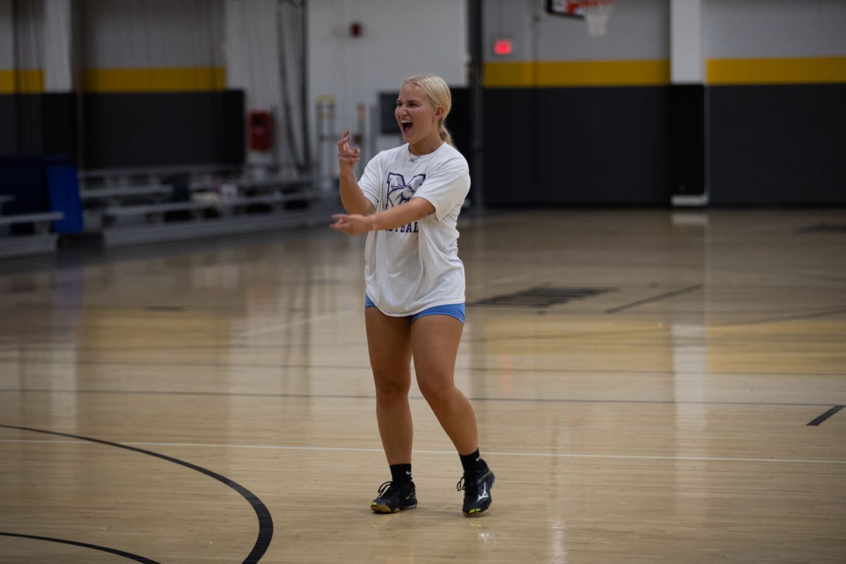 Olivia+Buerger+signs+after+winning+a+point+for+her+team+during+the+Deaf+Awareness+Week+volleyball+game+at+the+Iowa+Field+House+on+Monday%2C+Sept.+18%2C+2023.
