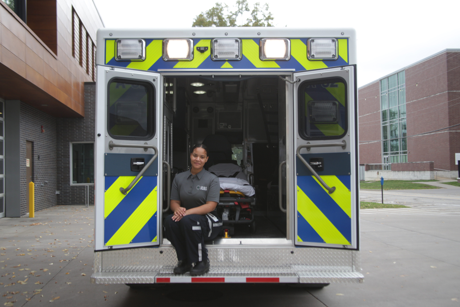 EMT apprentice Imonie Eicher poses for a portrait in a Johnson County Ambulance at the Johnson County Ambulance Facility in Iowa City on Thursday, Sept. 21, 2023. 
