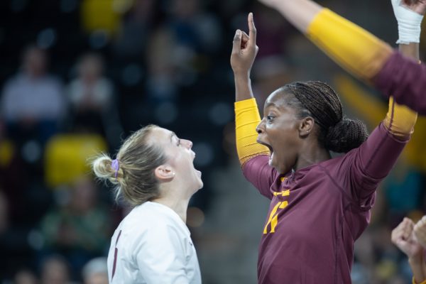 Middle blocker Phoebe Awoleye celebrates with Kylie Murr during the Iowa vs. Minnesota Volleyball game at Xtream arena on Sept. 21, 2023. The Gophers won 3-2.