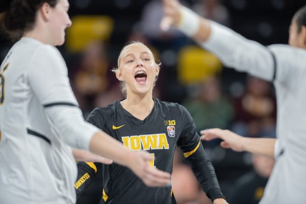 Sydney Dennis celebrates during a volleyball game between Iowa and Minnesota at Xtream Arena in Coralville on Thursday, Sept. 21, 2023. The Gophers defeated the Hawkeyes, 3-2.