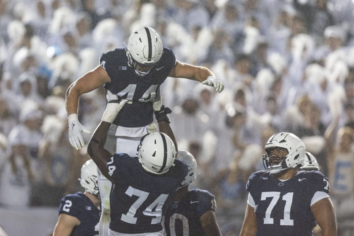 Penn State tight end Tyler Warren celebrates with offensive lineman Olumuyiwa Fashanu during a football game between No. 24 Iowa and No. 7 Penn State at Beaver Stadium in State College, Pa., on Saturday, Sept. 23, 2023. The Nittany Lions defeated the Hawkeyes, 31-0. Warren scored two touchdowns.