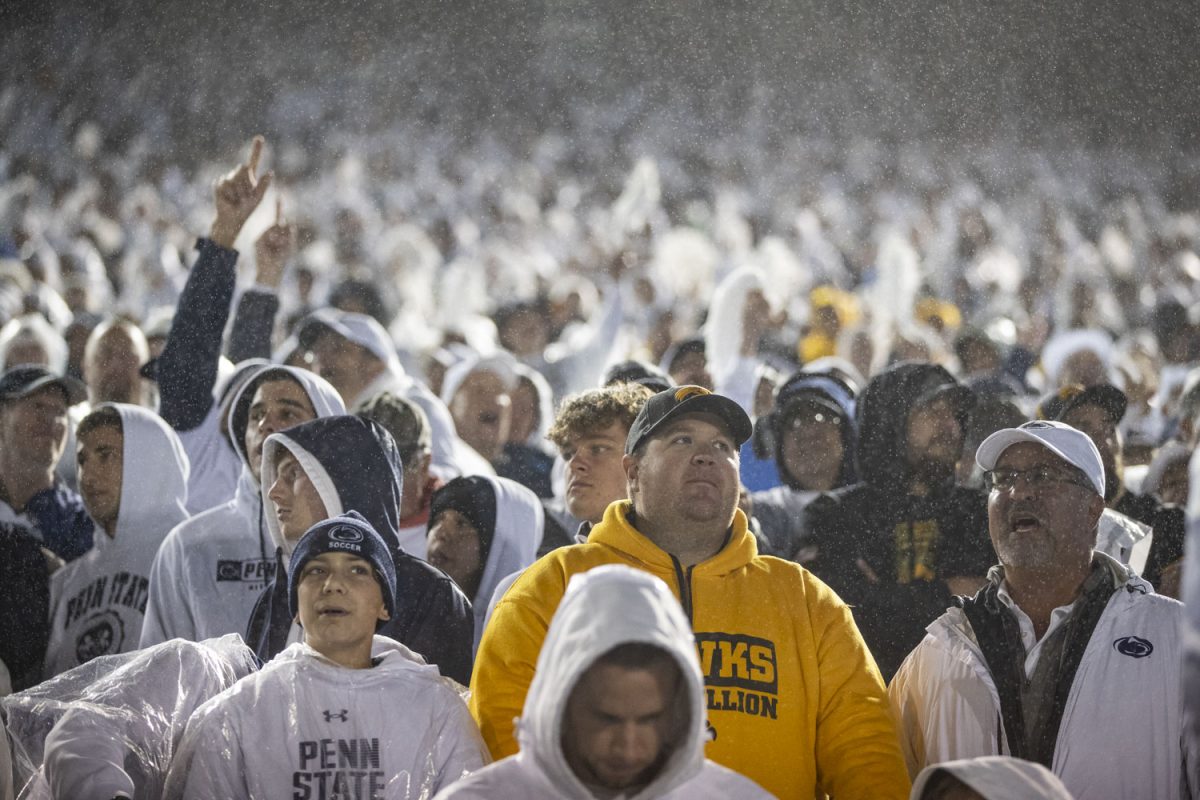 Fans react to play action during a football game between No. 24 Iowa and No. 7 Penn State at Beaver Stadium in State College, Pa., on Saturday, Sept. 23, 2023. The Nittany Lions defeated the Hawkeyes, 31-0. This is Iowas first loss of the season making their record 3-1.