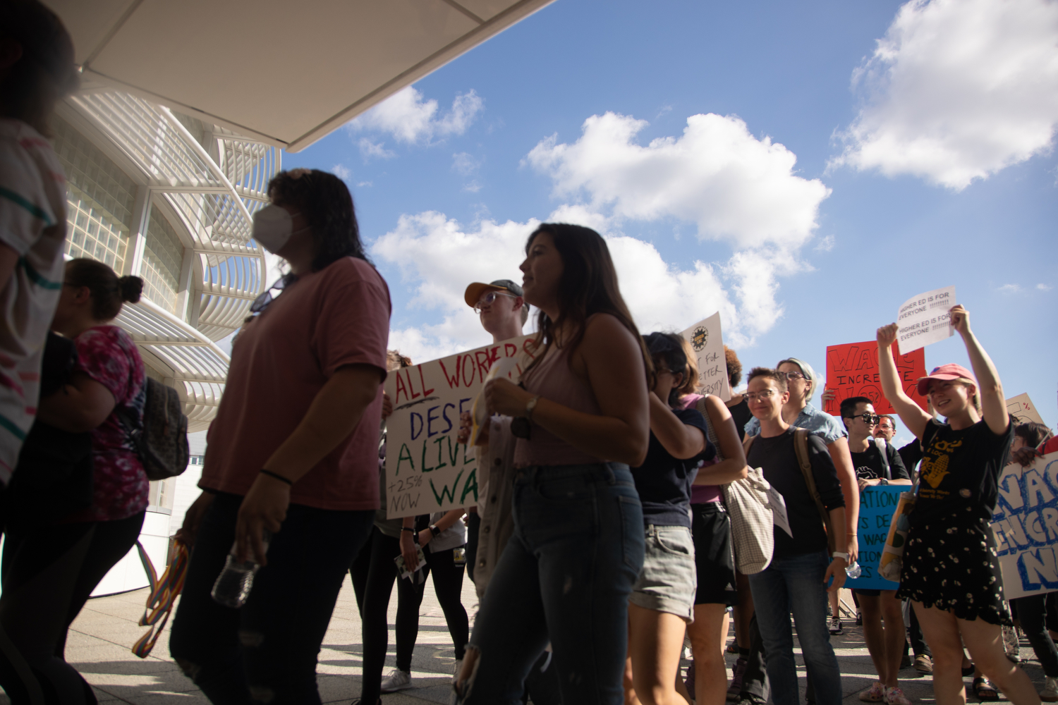 A group marches into the Levitt Center for Advancement during the COGS protest on Wednesday, Sept. 27 2023. The group came with demands of making education accessible and wages competitive. The meeting adjourned once COGS protesters marched in chanting.