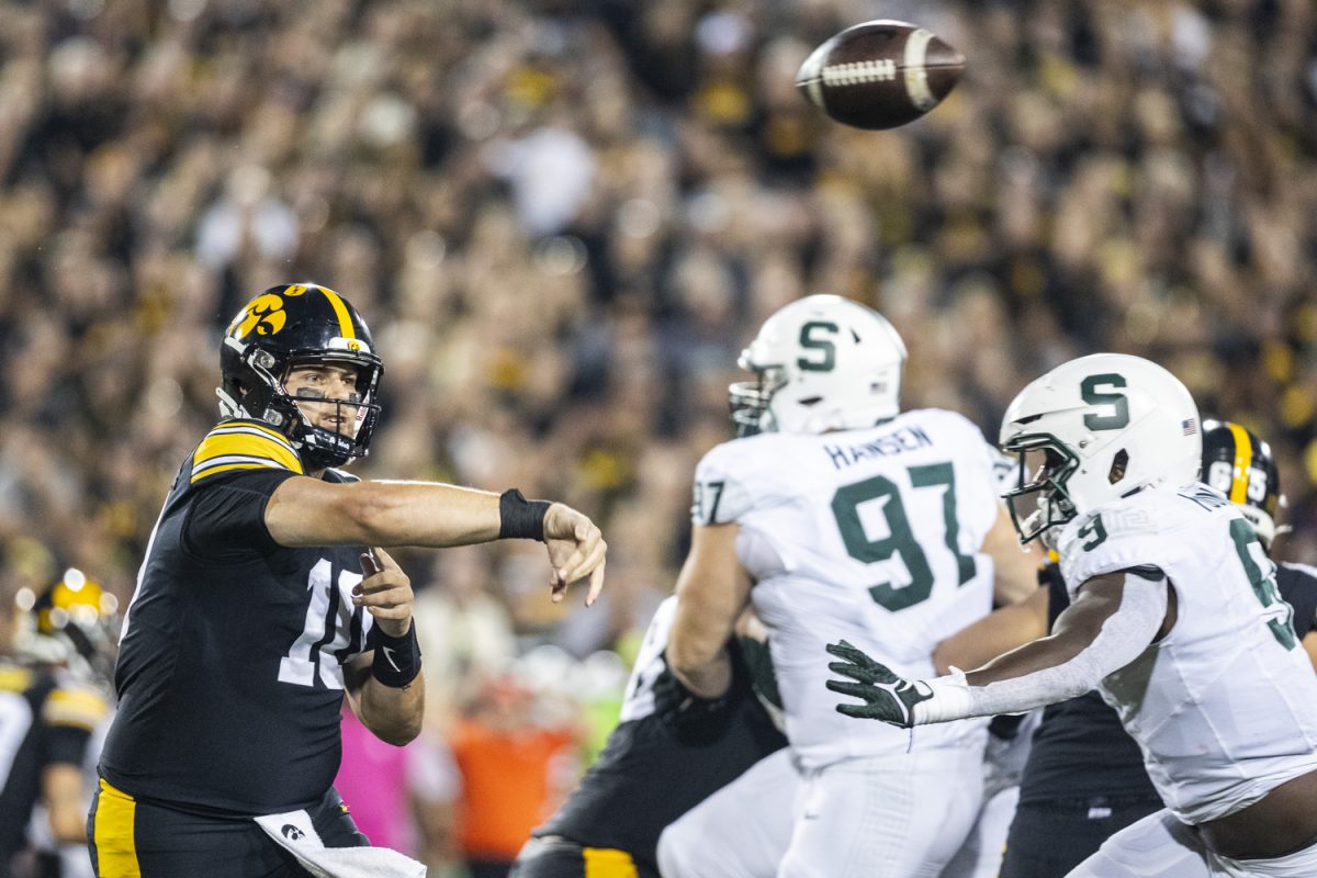 Iowa quarterback Deacon Hill throws a pass during a football game between Iowa and Michigan State at Kinnick Stadium in Iowa City on Saturday, Sept. 30, 2023.