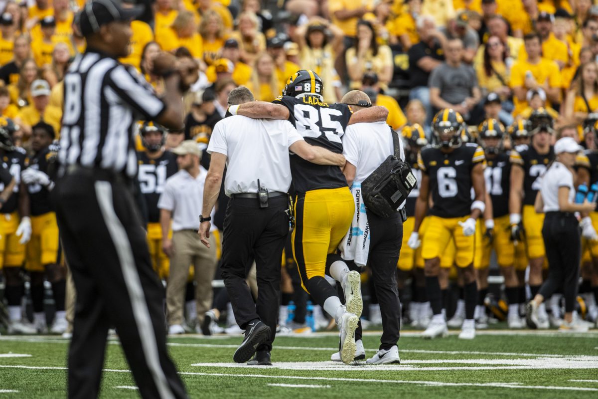 Iowa tight end Luke Lachey hops off the field after an ankle injury in the first quarter of a football game between Iowa and Western Michigan at Kinnick Stadium in Iowa City on Saturday, Sept. 16, 2023. (Grace Smith/The Daily Iowan)