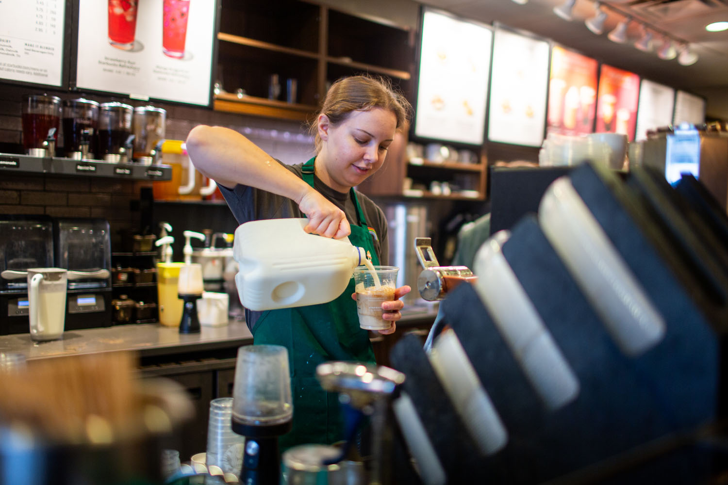Abi Scheppmann makes a drink at Starbucks in Iowa City on Wednesday, Sept. 6, 2023.