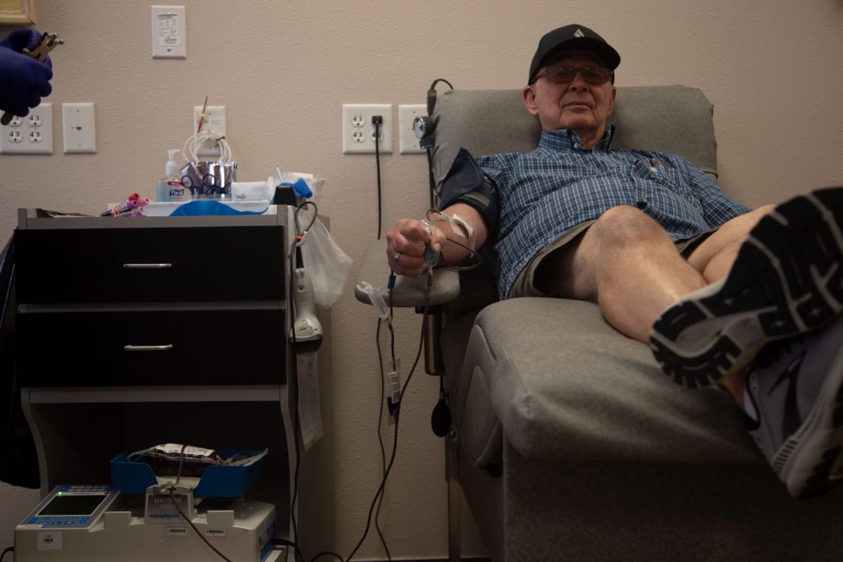 Skip+Kempnich+gives+his+blood+at+ImpactLife+on+Sept.+5%2C+2023.+ImpactLife+is+a+blood+donation+center+in+Coraville+working+to+combat+the+blood+shortage.+