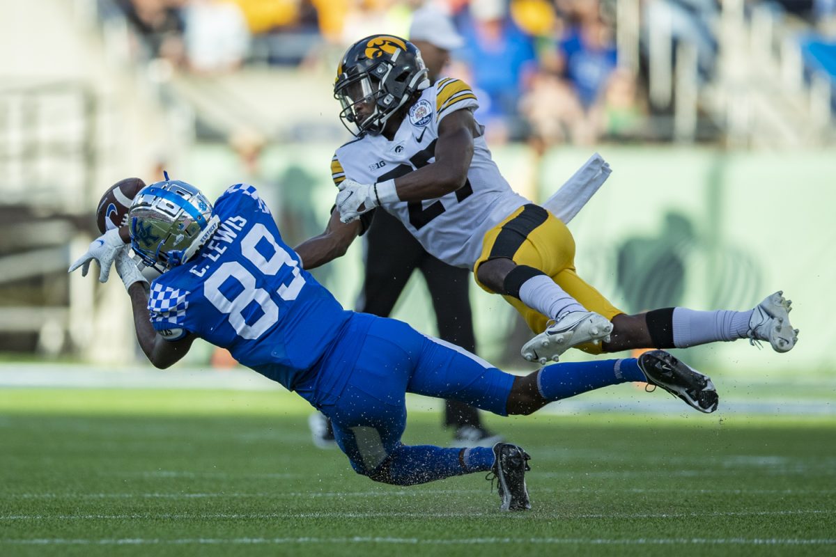 Iowa defensive back Jermari Harris breaks up a pass intended for Kentucky wide receiver Chris Lewis during the 2022 Vrbo Citrus Bowl between No. 15 Iowa and No. 22 Kentucky at Camping World Stadium in Orlando, Fla., on Saturday, Jan. 1, 2022. The Wildcats defeated the Hawkeyes, 20-17.