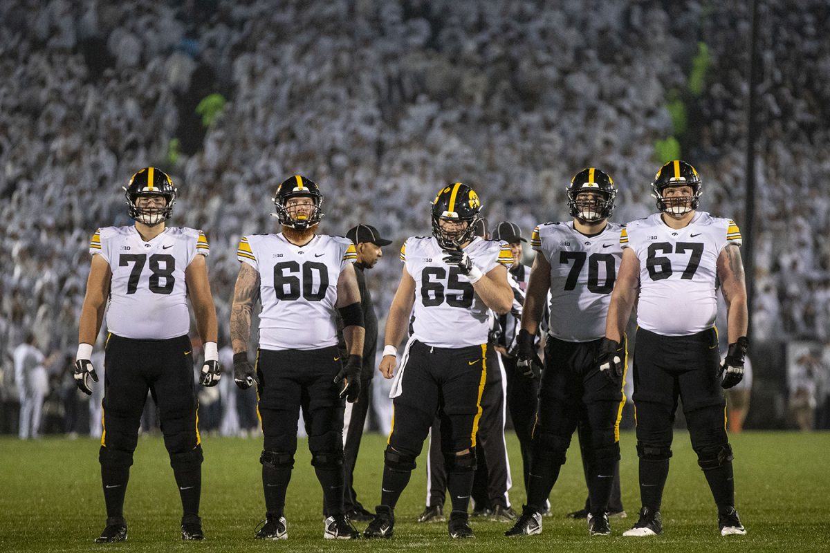 The Iowa offensive line stands on the field during a football game between No. 24 Iowa and No. 7 Penn State at Beaver Stadium in State College, Pa., on Saturday, Sept. 23, 2023. The Nittany Lions defeated the Hawkeyes, 31-0.