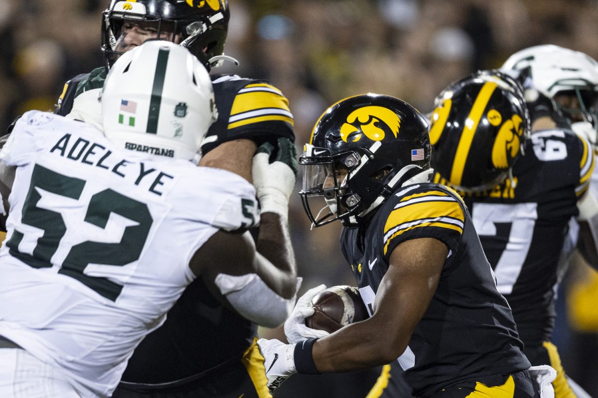 Iowa running back Terrell Washington, Jr. carries the ball during a football game between Iowa and Michigan State at Kinnick Stadium on Saturday, Sept. 30, 2023. The Hawkeyes defeated the Spartans, 26-16. Washington, Jr. rushed for three yards.